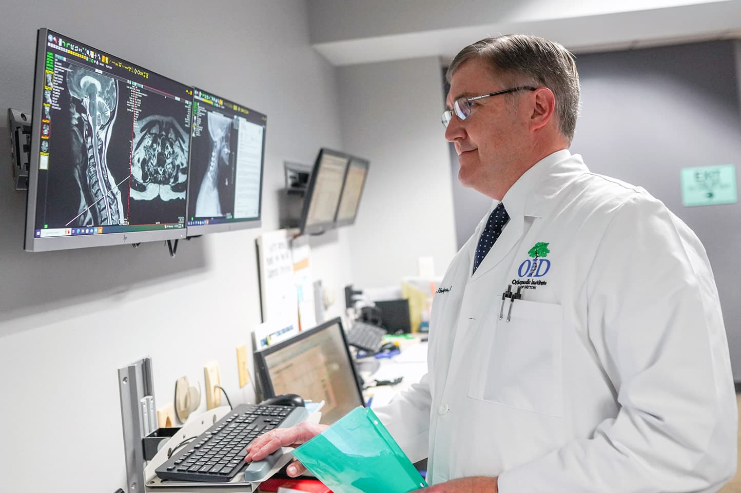 OID doctor looks at MRI results